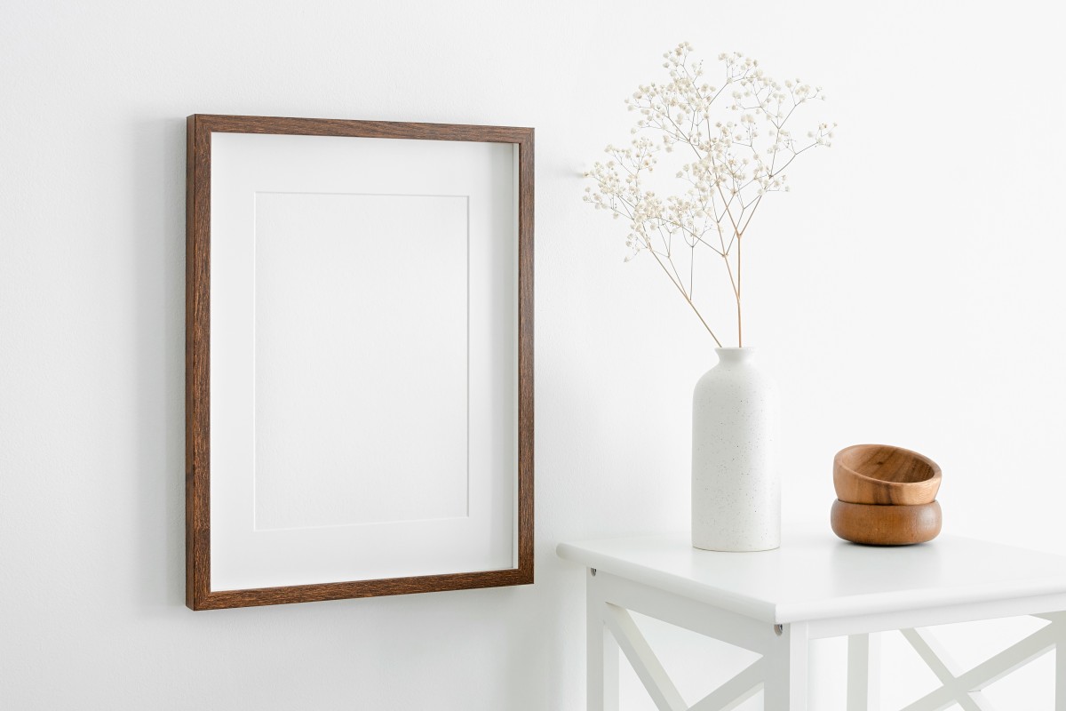 Simple frame and table with minimalist white vase AS_452545768 