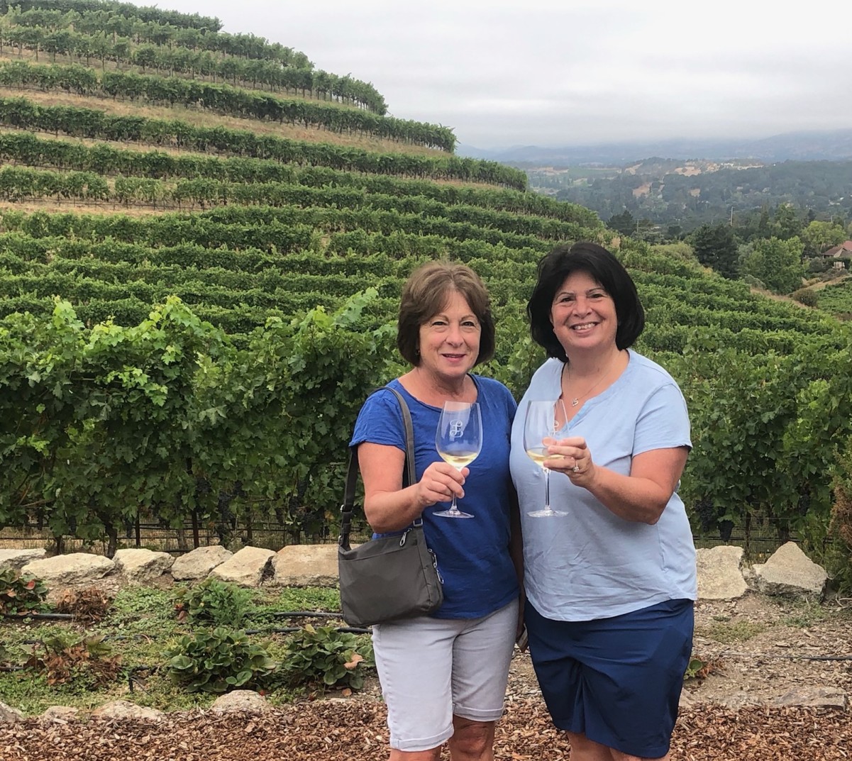 Pat DePietto and her sister wine tasting