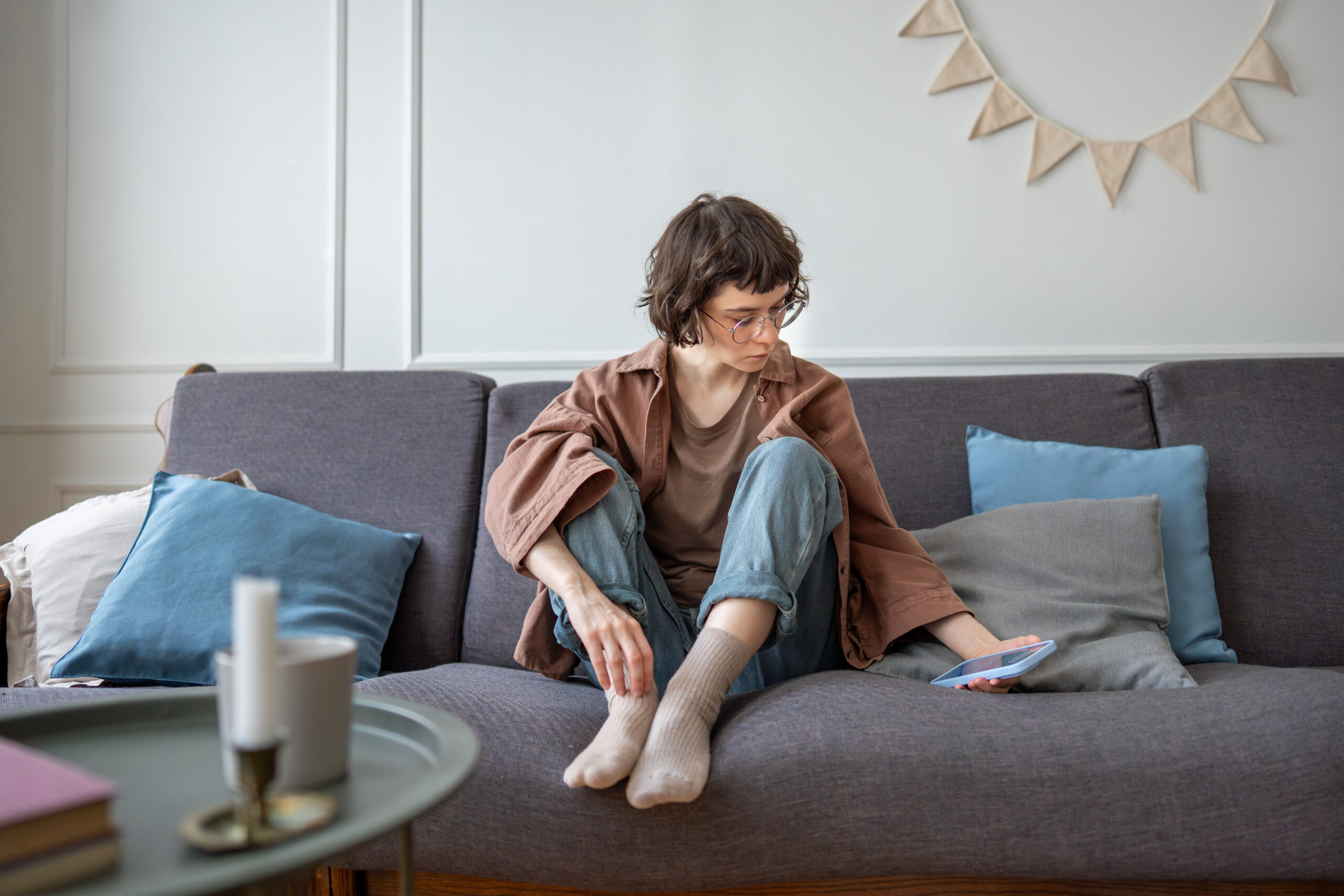 Upset pensive teen girl sadly looks on screen phone receive haters comments feels frustration, empty woman checks phone waiting messages banking online financial services on smartphone